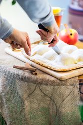 Person cutting apple cake dessert