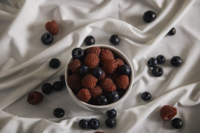 Appetizer plateful of berry on silk cloth