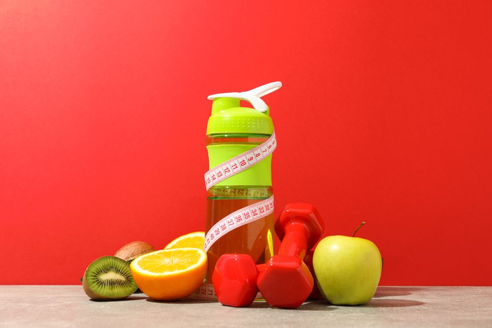 Loss weight accessories on grey table against red background