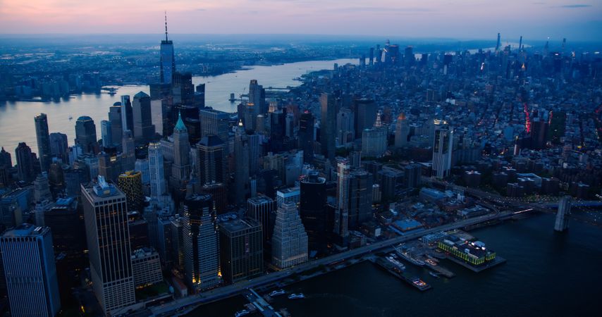 Cinematic Aerial Evening Shots Capturing New York City Skyscrapers. Panoramic Helicopter Fly-By Over the Roofs and Spires of Historic Urban Architecture in Wall Street Financial District