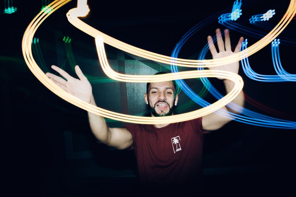 bearded man dancing in spotlight