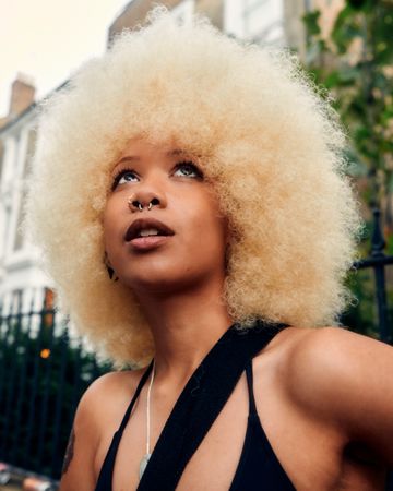 London, England, United Kingdom - August 28, 2022: Portrait of Black woman with Blonde afro
