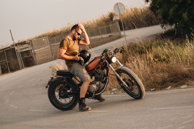 Strong man driving motorcycle