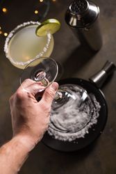 Preparing a margarita cocktail