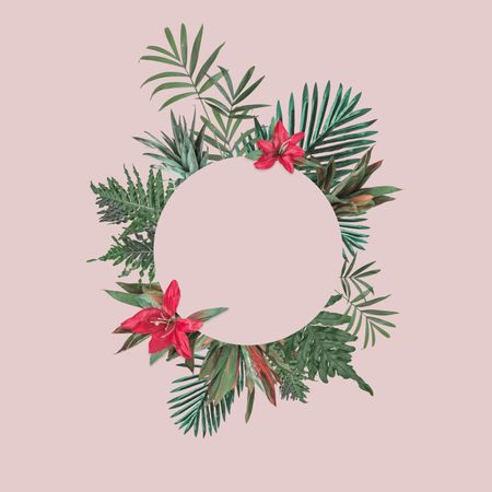 Leaves and red flowers in wreath on blush background