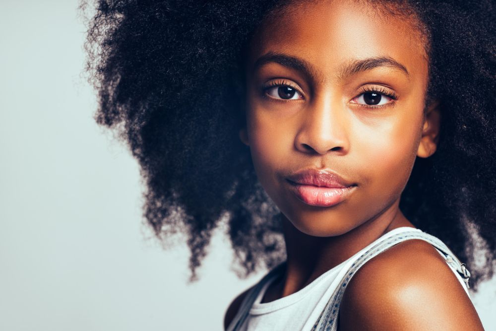 Portrait of girl’s face looking intently into camera