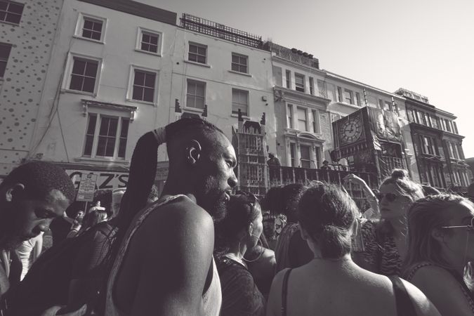 London, England, United Kingdom - August 25th, 2019: Man walking through crowd in London