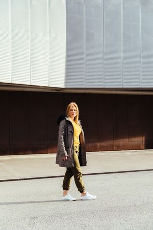 Blonde woman walking in the city