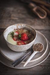 Strawberry porridge in bowl on table