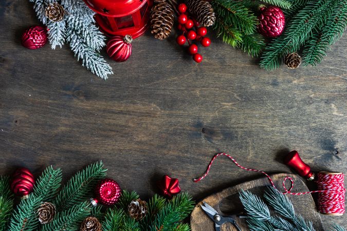 Top view of Christmas setting with pine branches on wooden table