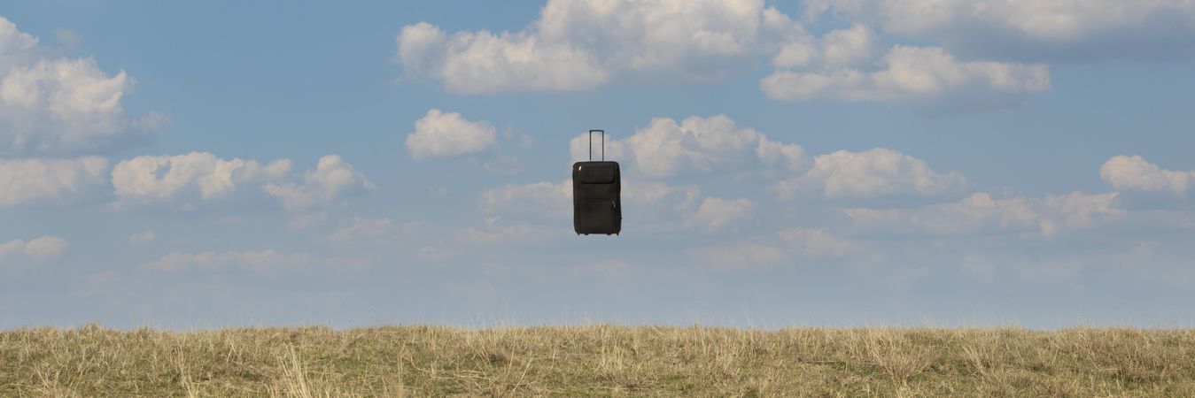 Banner of suitcase suspended in air