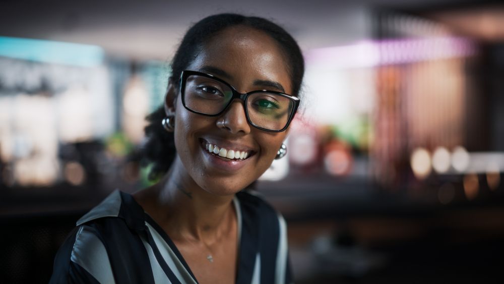 Portrait of Successful Black Businesswoman Using Desktop Computer, Analysing Data, Thinking and Solving Problems.
