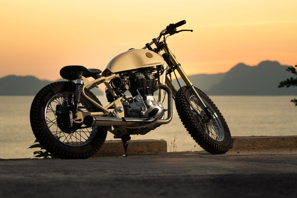 Motorbike near sea during sunset