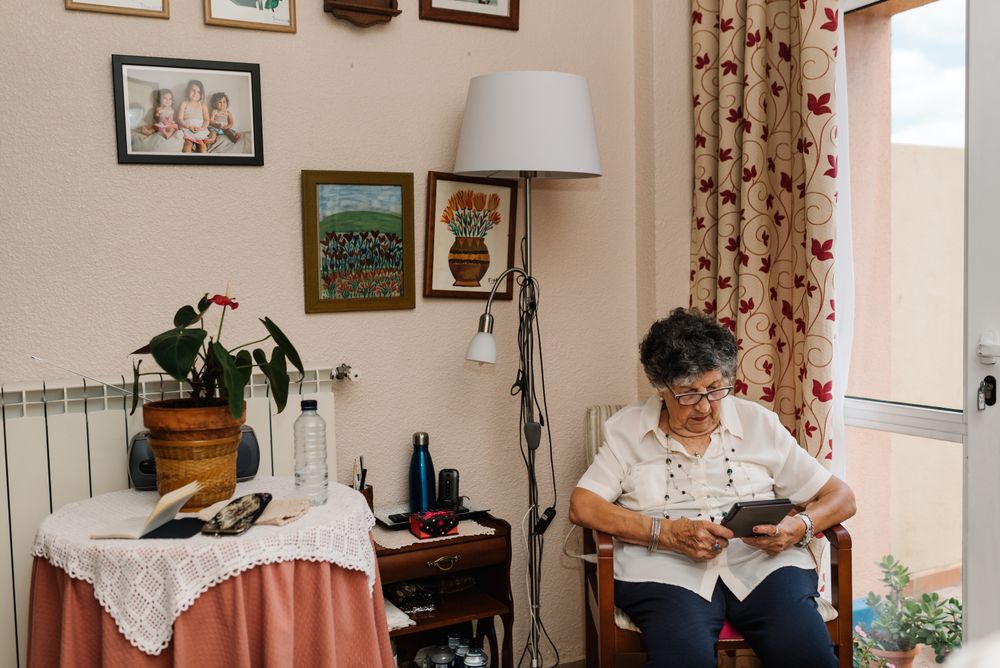 Mature female reading e-book at home