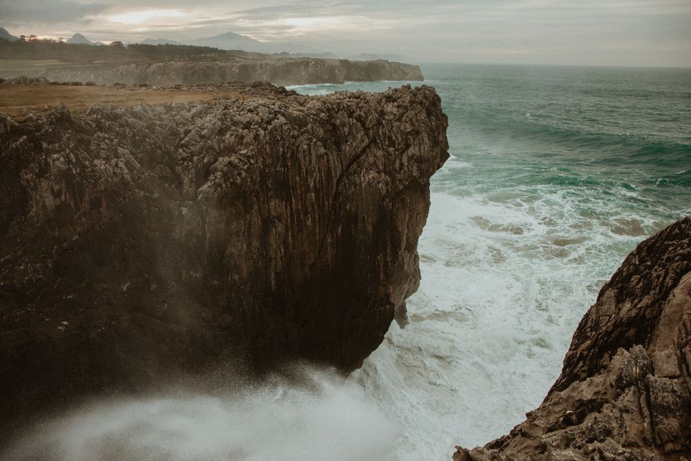 edge of cliff near water