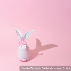 Egg wrapped in light paper in Easter bunny shape 0JWy85