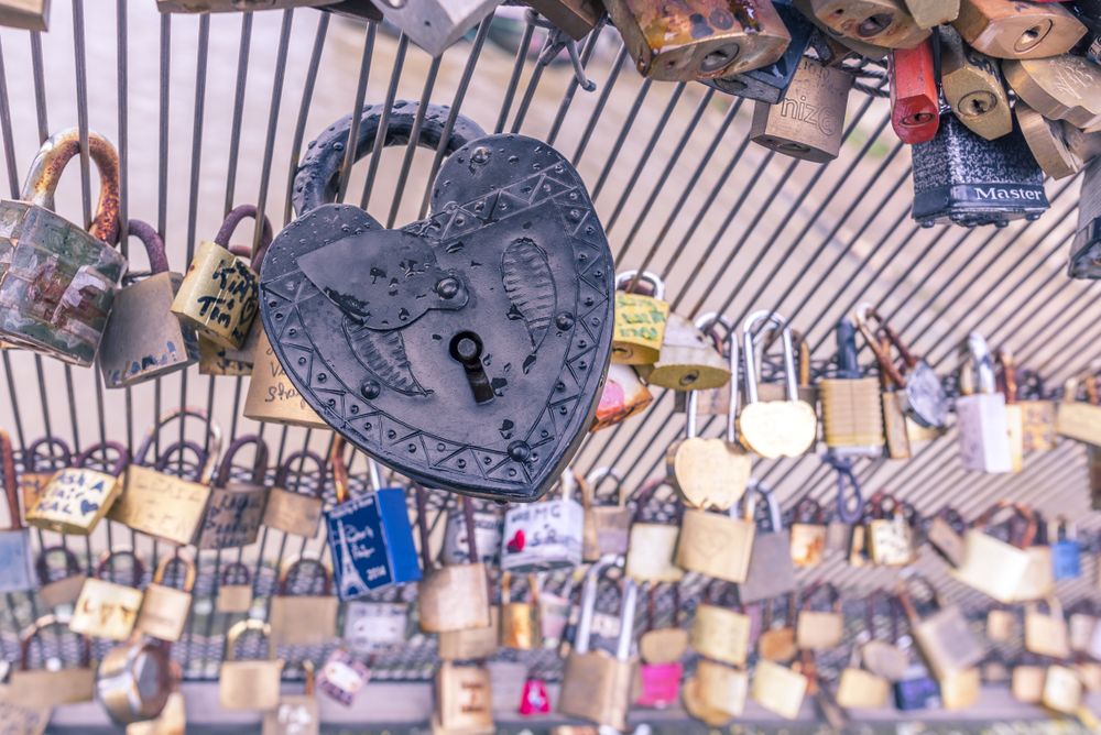 Vintage heart shaped lock on a fence