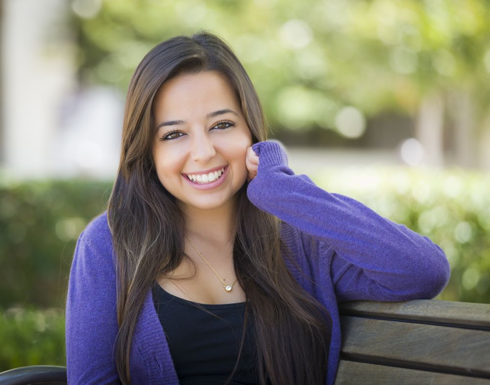 Smiling Female Student Portrait on School Campus