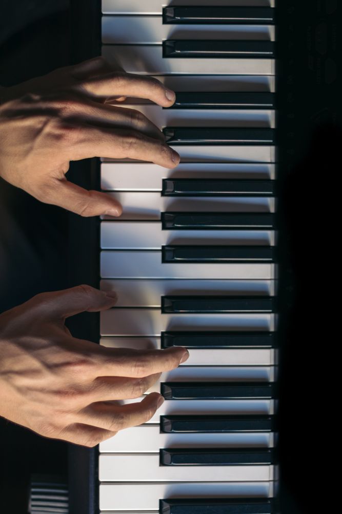 man playing piano. top view. vertical