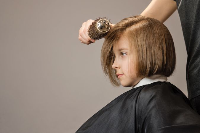 Child Modeling a Bob Haircut
