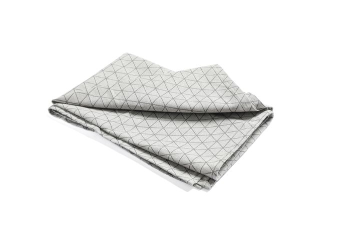 Folded grey napkin isolated on blank background
