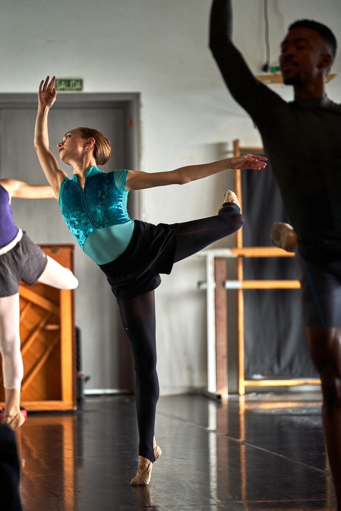 Ballet dancer warming up and dancing at a dance academy
