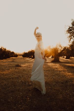 Woman in dress posing on nature