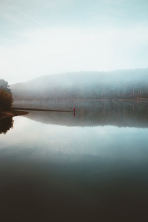Beautiful tranquil lake in fog