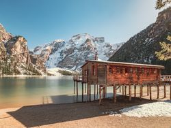 Wooden house on stilts on serene lake
