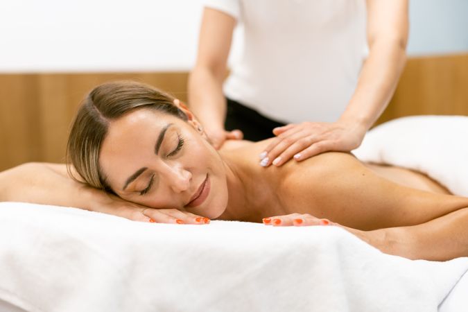 Woman enjoying a relaxing massage with eyes closed