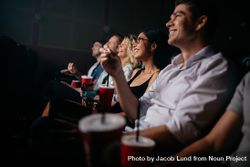 Group of people in theater with popcorn and drinks bEBrl0