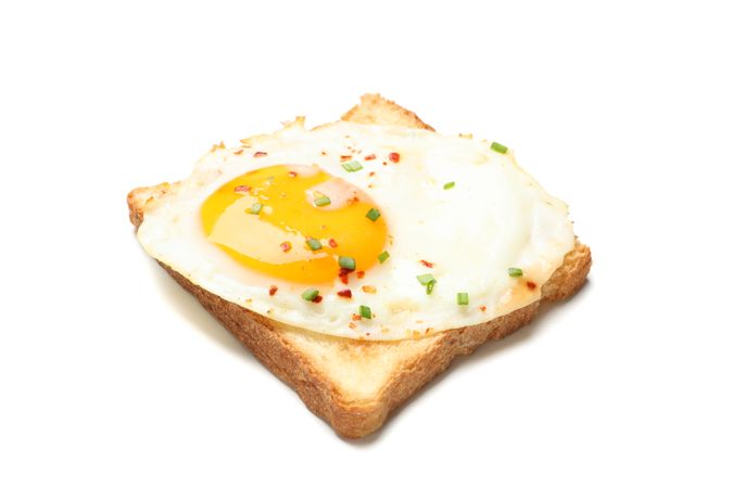 Seasoned fried egg on toast