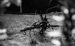 Old farming equipment in field