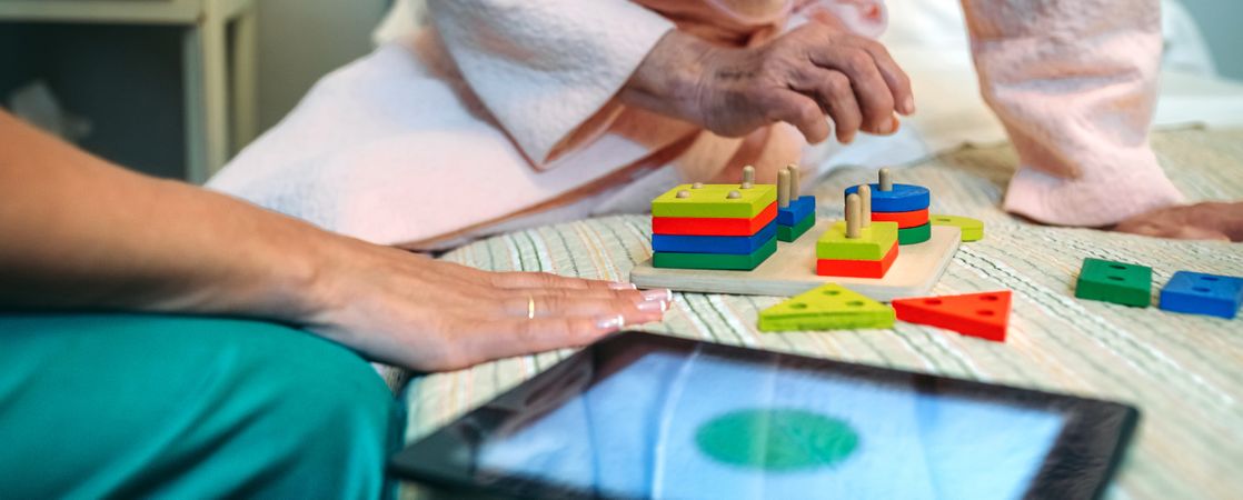 Female doctor showing shapes to patient