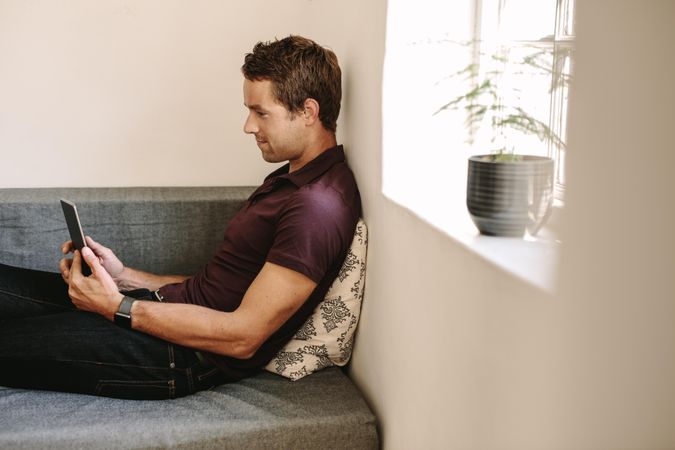 Man using digital tablet while working from home