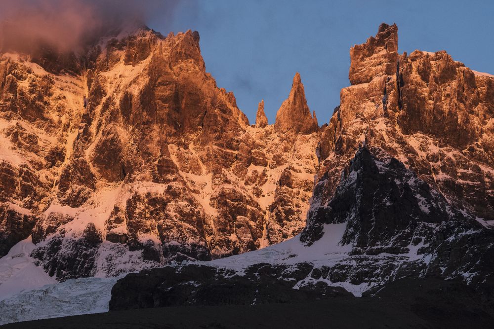 Mountain peaks covered by snow in warn sun light