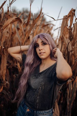 Casual woman in dry vegetation