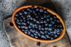 Top view of blueberries in terracotta dish
