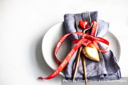 St. Valentine day concept of heart decorations and ribbon with cutlery 0WOOXx