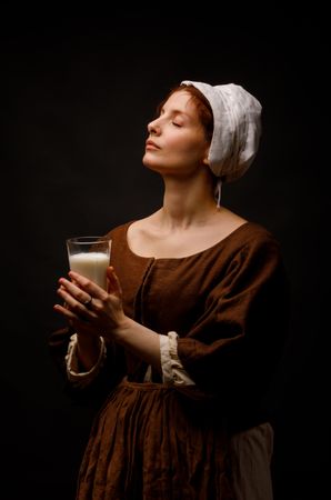 Medieval maid with glass of milk