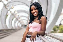 Portrait of a Black young woman enjoying the summer in the city