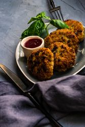Pork cutlets served with fresh basil