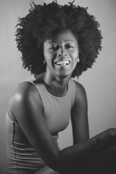 Happy female in vest in monochrome studio shot