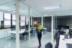 Blurred woman with folders in office