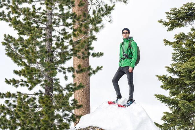 Hiker in snowy forest in Yosemite California