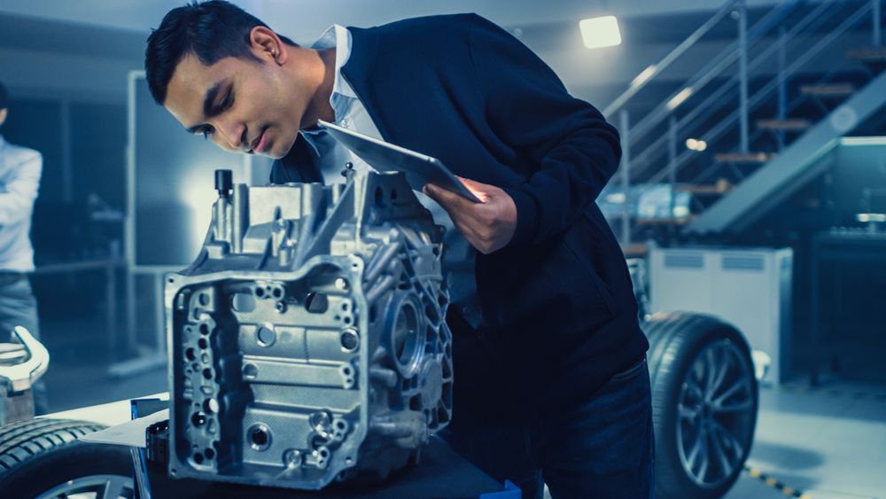 Development Laboratory Room with Professional Automotive Design Engineer Working on a Electric Car Gear Transmission.