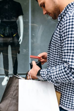 Man taking out credit card