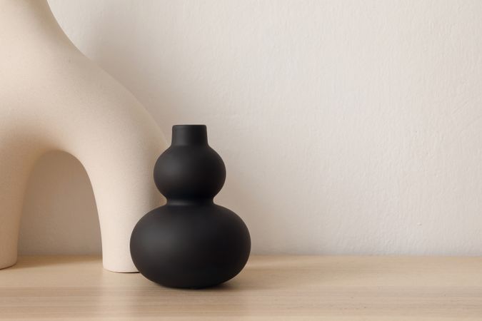 Modernist empty vase on wooden table