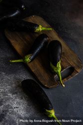 Eggplants on wooden board 56GxdN