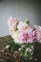 Bunch of flowers in vase on table